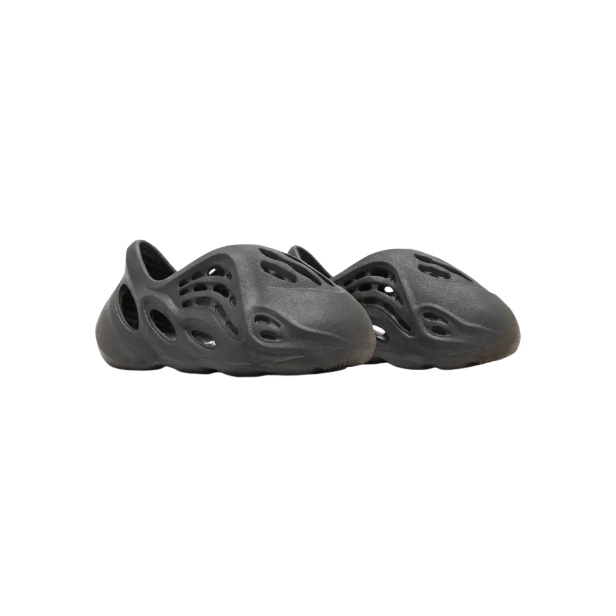 Explore the adidas Yeezy Foam Runner Kids ‘Onyx,’ featuring a sleek black injected EVA foam build with strategically placed vents for breathability. The molded upper offers comfort with a textured footbed, while the wavy traction outsole ensures optimal grip across various surfaces.
