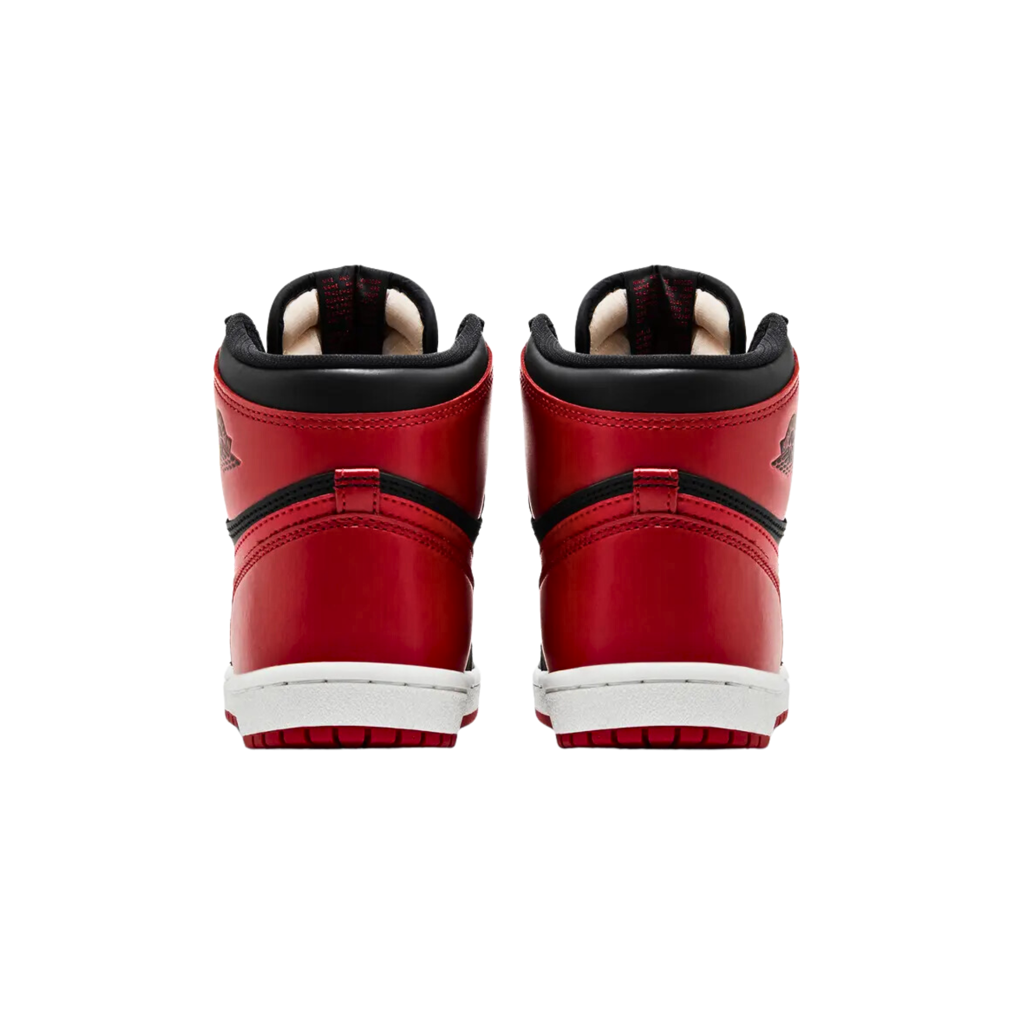 Air Jordan 1 Retro High '85 OG 'Bred' (2025) featuring a black leather upper with Varsity Red accents on the perforated toe, signature Swoosh, heel overlay, and collar flap. The sneaker includes a debossed Wings logo, woven Nike Air tag on the nylon tongue, and a white rubber cupsole with a durable crimson outsole.