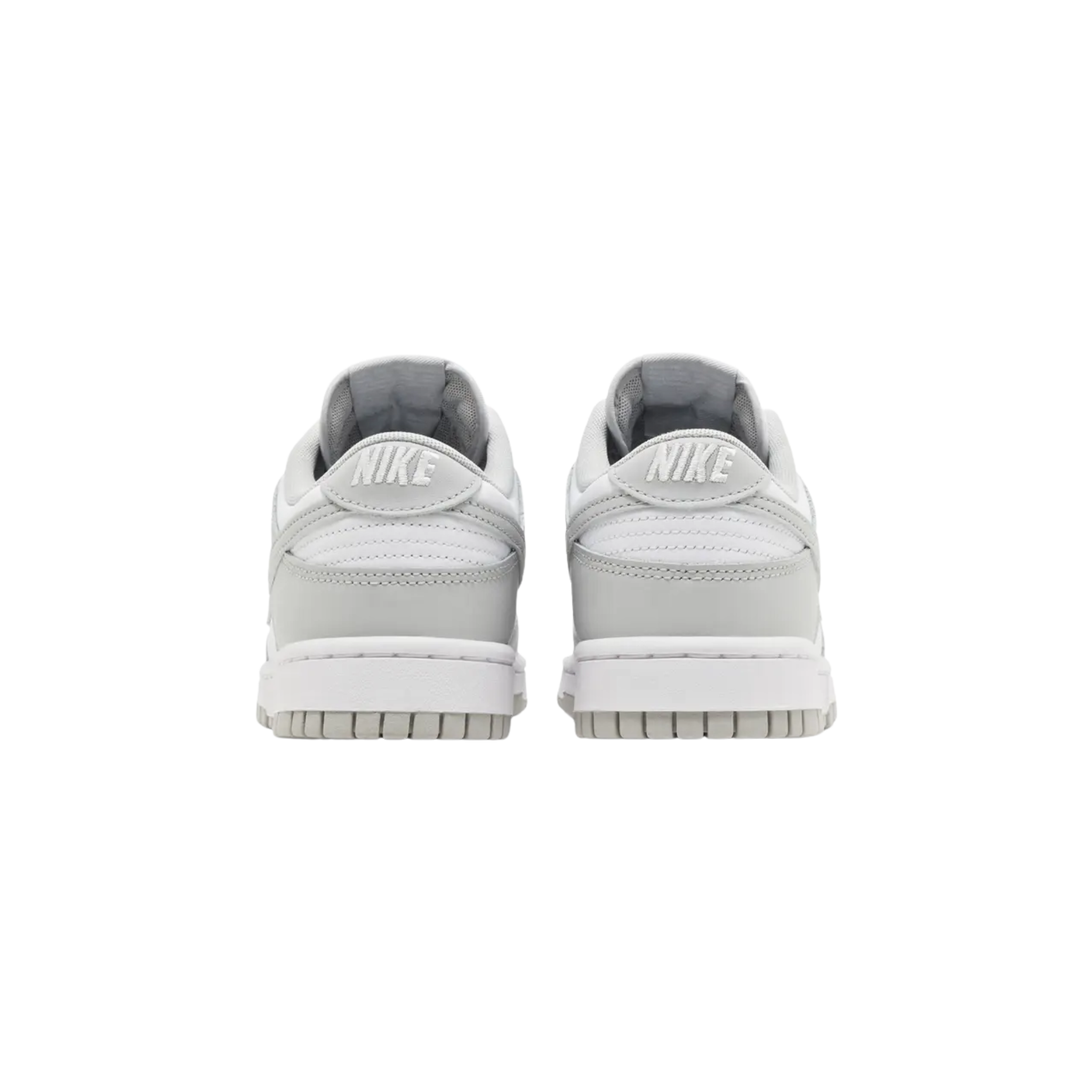 The Nike Dunk Low ‘Grey Fog’ features a subtle two-tone colorway with a white leather base and light grey overlays. The neutral tones are echoed on the Swoosh, laces, and woven Nike tongue tag, while additional Nike branding appears on the heel tab and padded sockliner. The low-top sits on a rubber cupsole, combining white sidewalls with a grey rubber outsole for a clean, versatile look.