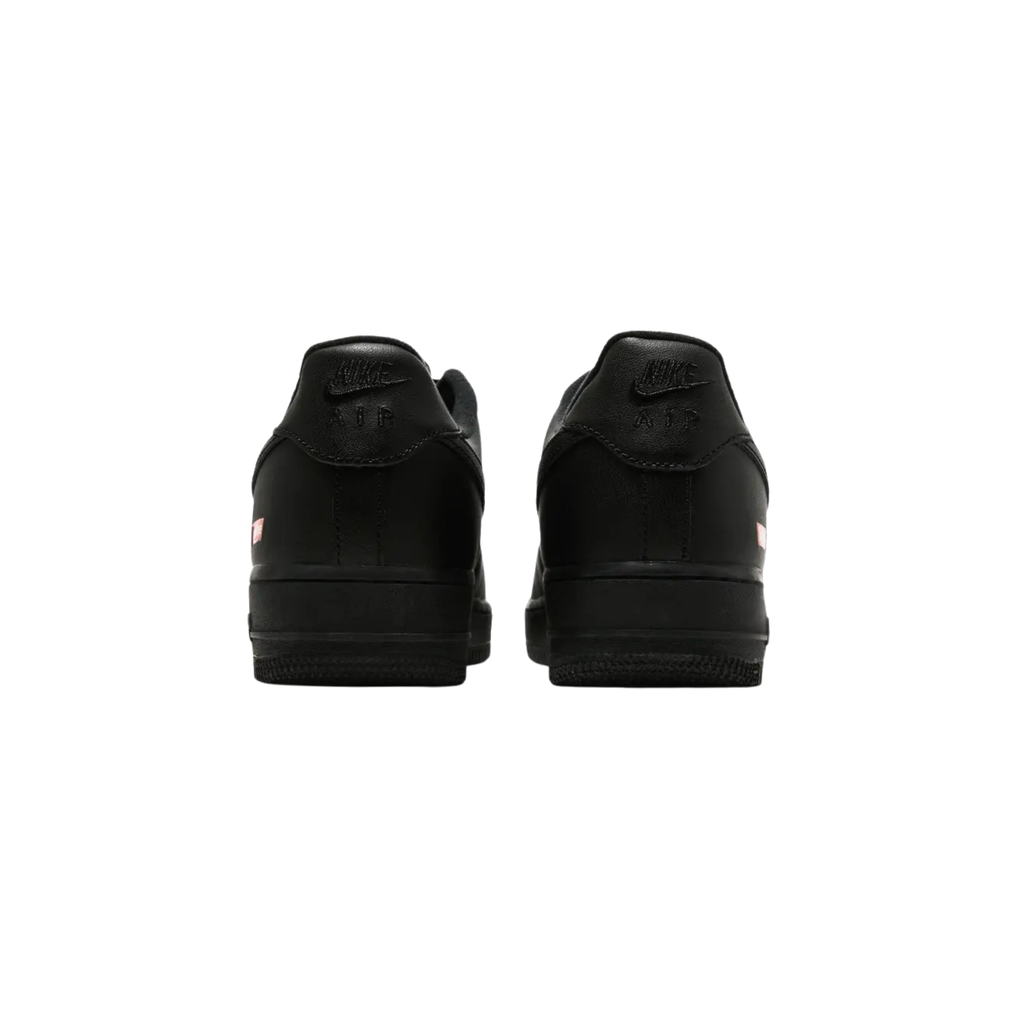 The Supreme x Air Force 1 Low ‘Box Logo’ debuted in the Spring/Summer 2020 collection, featuring a minimalist all-black full-grain leather upper. Supreme's iconic red box logo is displayed on the lateral heel and custom sockliner, alongside a Nike Air logo. The sneaker comes with an additional set of black laces, each printed with Supreme branding, completing the sleek and understated design.