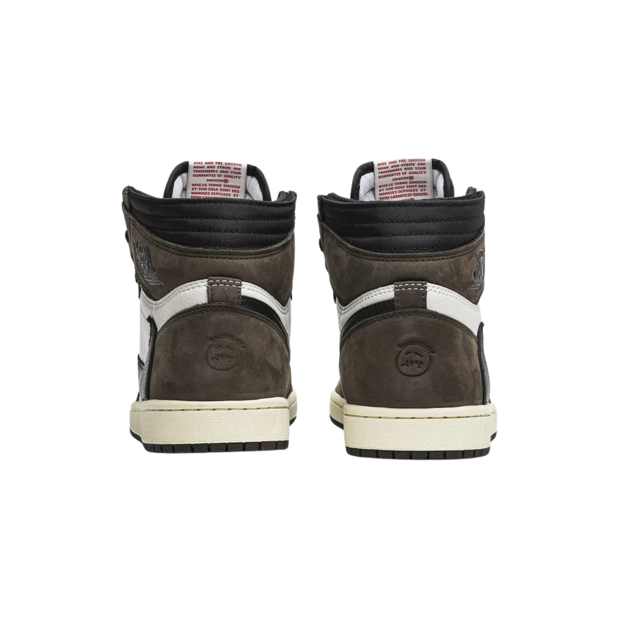 The Travis Scott x Air Jordan 1 Retro High features a white leather and brown suede upper with an oversized backward-facing Swoosh on the lateral side and a traditional Swoosh on the medial side. The shoe also includes a double-layer collar and Scott’s face logo embossed on the heel.