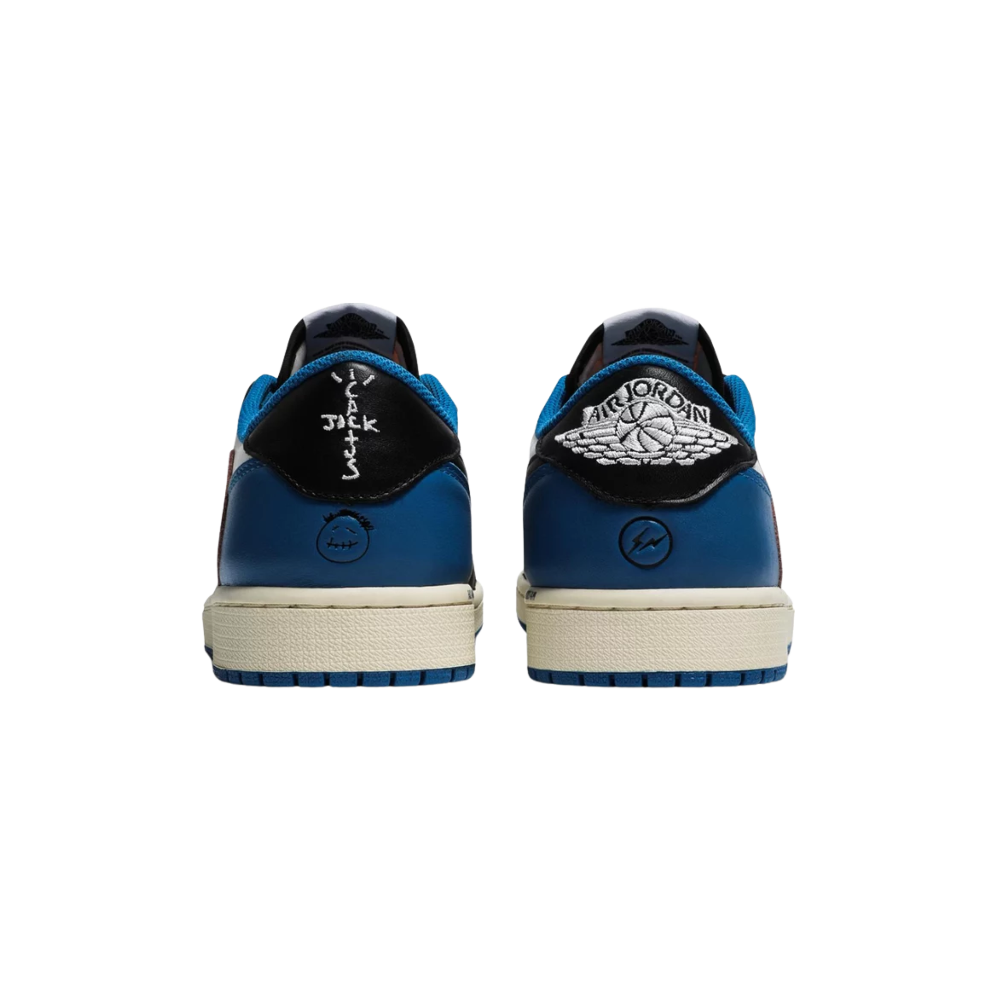 Fragment Design x Travis Scott x Air Jordan 1 Retro Low featuring a white leather upper with black and royal blue overlays. The sneaker includes Scott’s oversized inverted Swoosh in off-white on the lateral side, a black standard Swoosh on the opposite side, and Cactus Jack branding with a smiley face logo on the left heel tab. The right heel tab features a Jordan Wings logo and Fragment’s lightning bolt trademark.