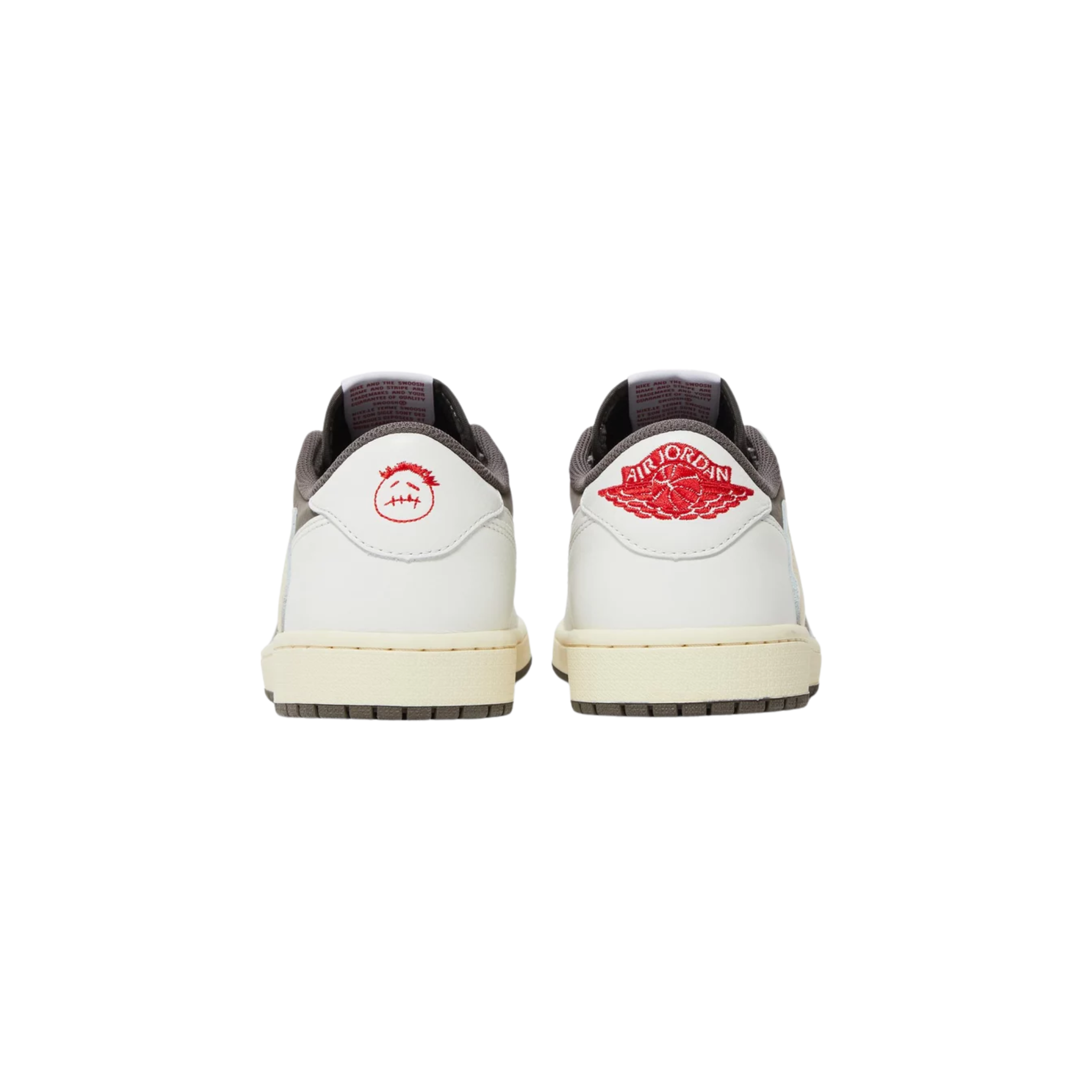 Travis Scott x Air Jordan 1 Retro Low OG ‘Reverse Mocha’ featuring a brown suede base with ivory leather overlays and a reverse Swoosh on the lateral side in oversized dimensions. The sneaker includes scarlet accents on the woven Nike Air tongue tags, mismatched Cactus Jack and retro Wings logos on the heel tabs, a vintage off-white rubber midsole with encapsulated Nike Air cushioning in the heel, and a brown rubber outsole.