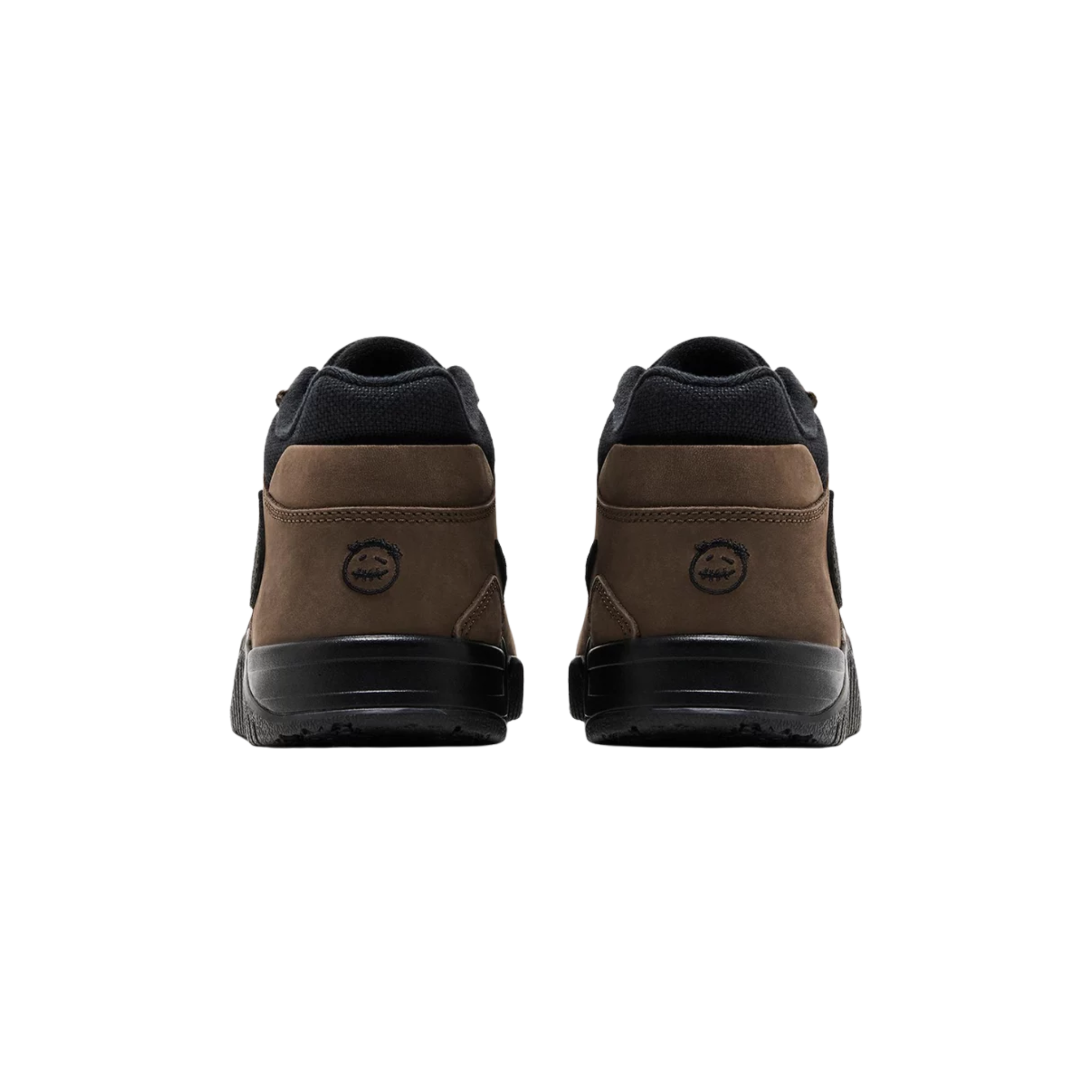 Travis Scott x Jordan Jumpman Jack TR 'Dark Mocha' featuring a black canvas upper with brown nubuck overlays and a black suede reverse Swoosh. The sneaker includes tonal Jumpman branding on the tongue, Cactus Jack smiley logo on the back heel, and 'TS' embroidery on the forefoot strap. A black rubber outsole with an oversized 'Jack' graphic and a matching black foam midsole provide durability and traction.