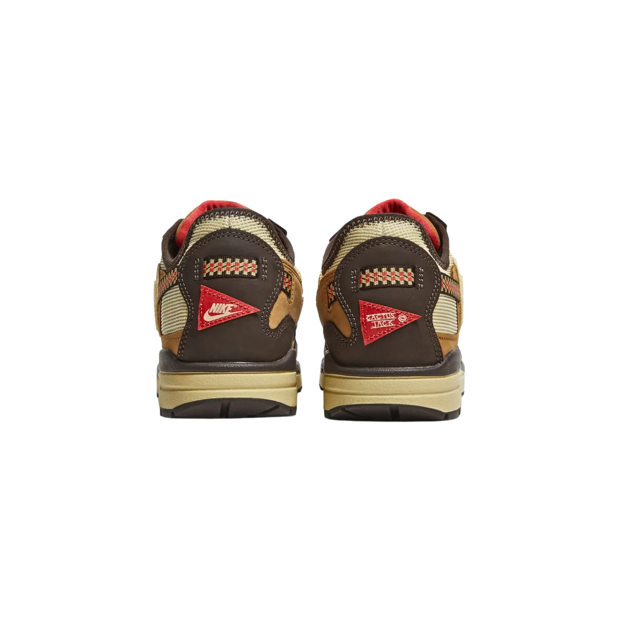 The Travis Scott x Nike Air Max 1 ‘Baroque Brown’ features a rugged outdoor-inspired design with a cream mesh upper, dark tan leather overlays, and a brown nubuck mudguard. Red hiker-style laces secure the shoe, with a reverse Lemon Drop Swoosh on the lateral panel. Multicolor woven straps are integrated into the laces and heel overlay, which sports a crimson patch with Cactus Jack branding on the right shoe and a Nike logo on the left.