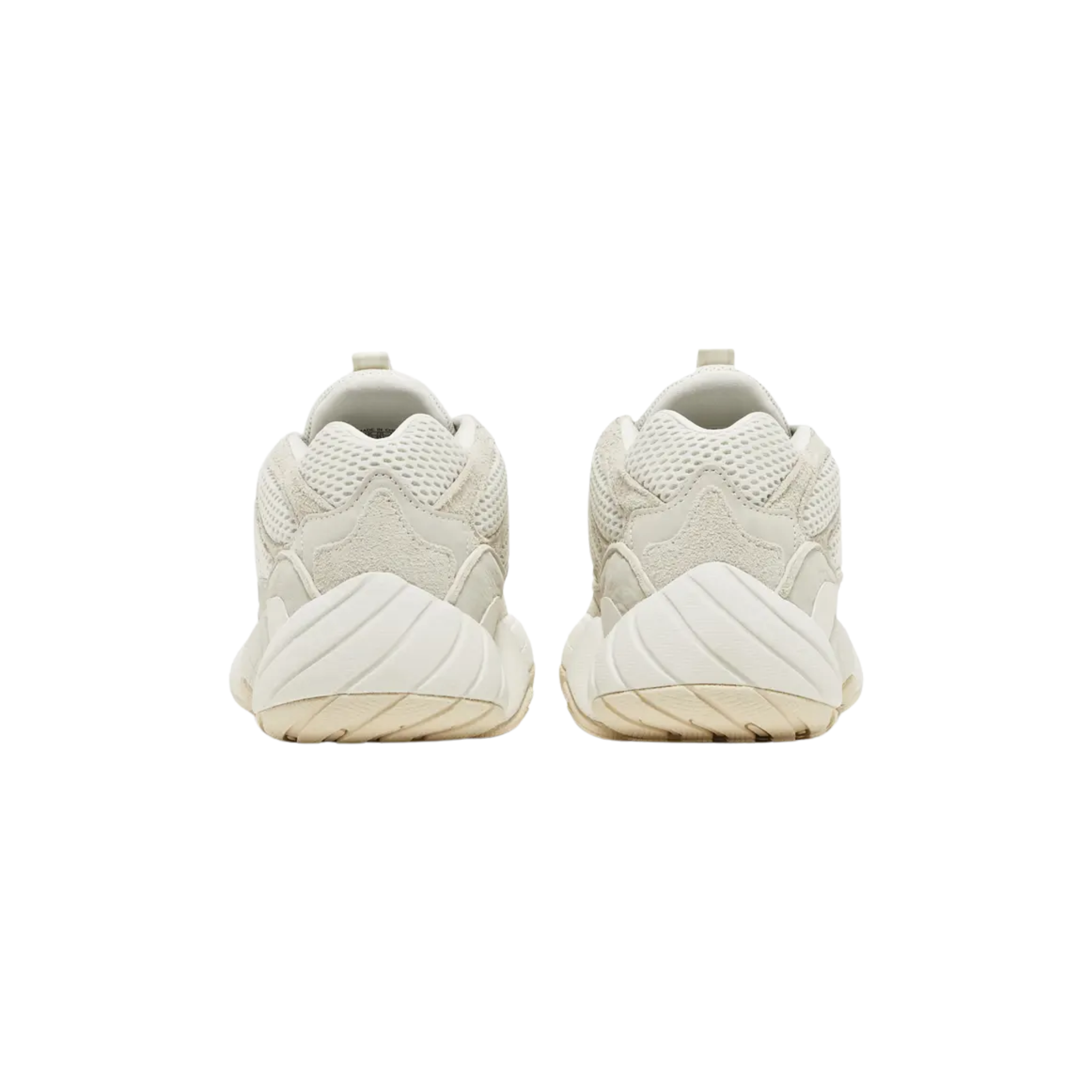 Shop the 2023 adidas Yeezy 500 ‘Bone White,’ featuring a subdued ivory colorway with a mesh upper and suede and leather overlays. The seamless rubber mudguard offers support and durability, while reflective piping enhances visibility. A podular adiPRENE+ midsole provides lightweight cushioning, inspired by the adidas KB8 3.