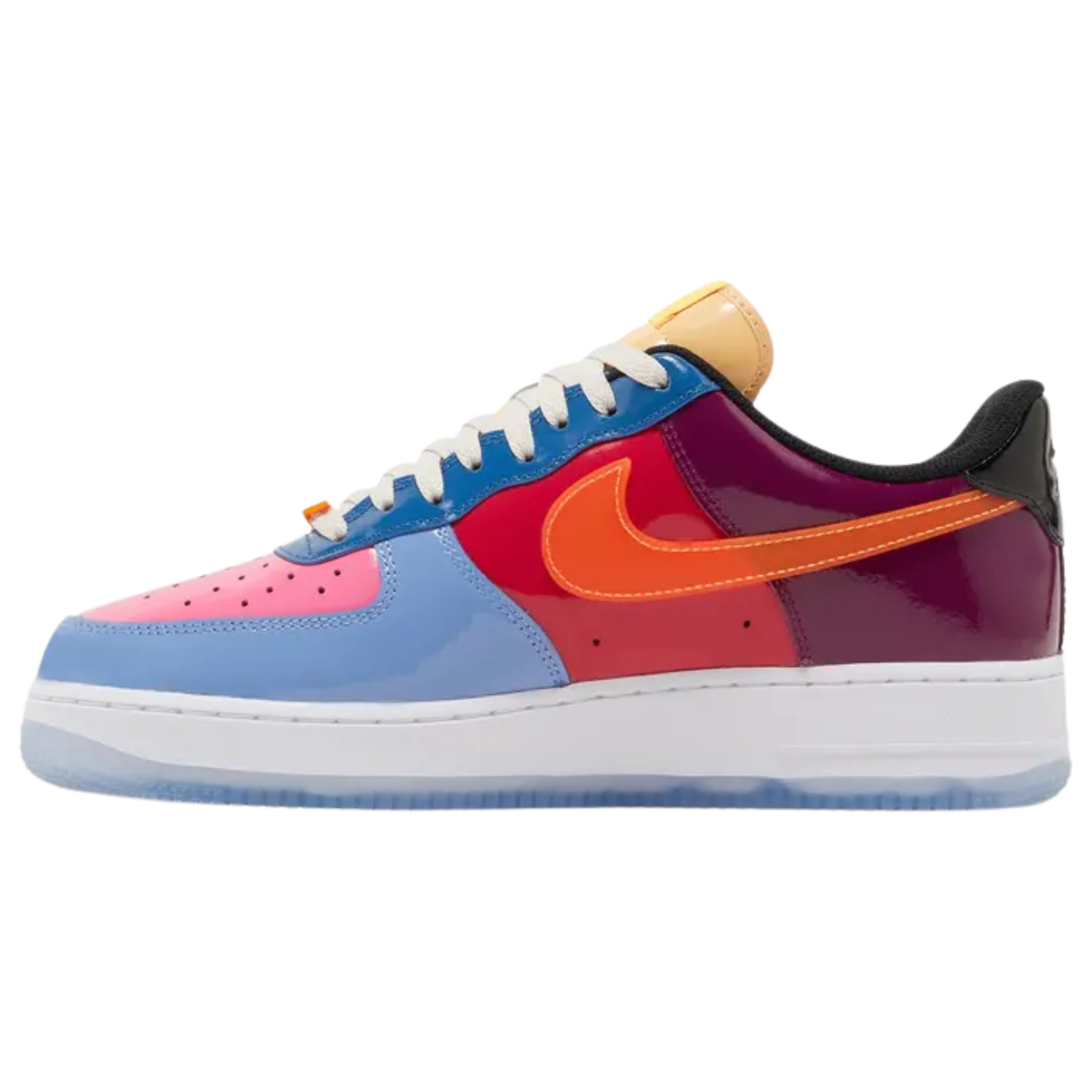 The Undefeated x Nike Air Force 1 Low ‘Total Orange’ features a glossy patent leather upper with a bold mix of blue, fuchsia, crimson, purple, and black. The shoe includes a stitched orange Swoosh, UNDFTD lace dubrae, and a debossed Nike Air logo on the heel tab. Undefeated's Five Strikes graphic appears on the lateral heel and woven tongue tag. The sneaker is set on a white midsole with encapsulated Air-sole cushioning and a translucent rubber outsole for a stylish, comfortable finish.