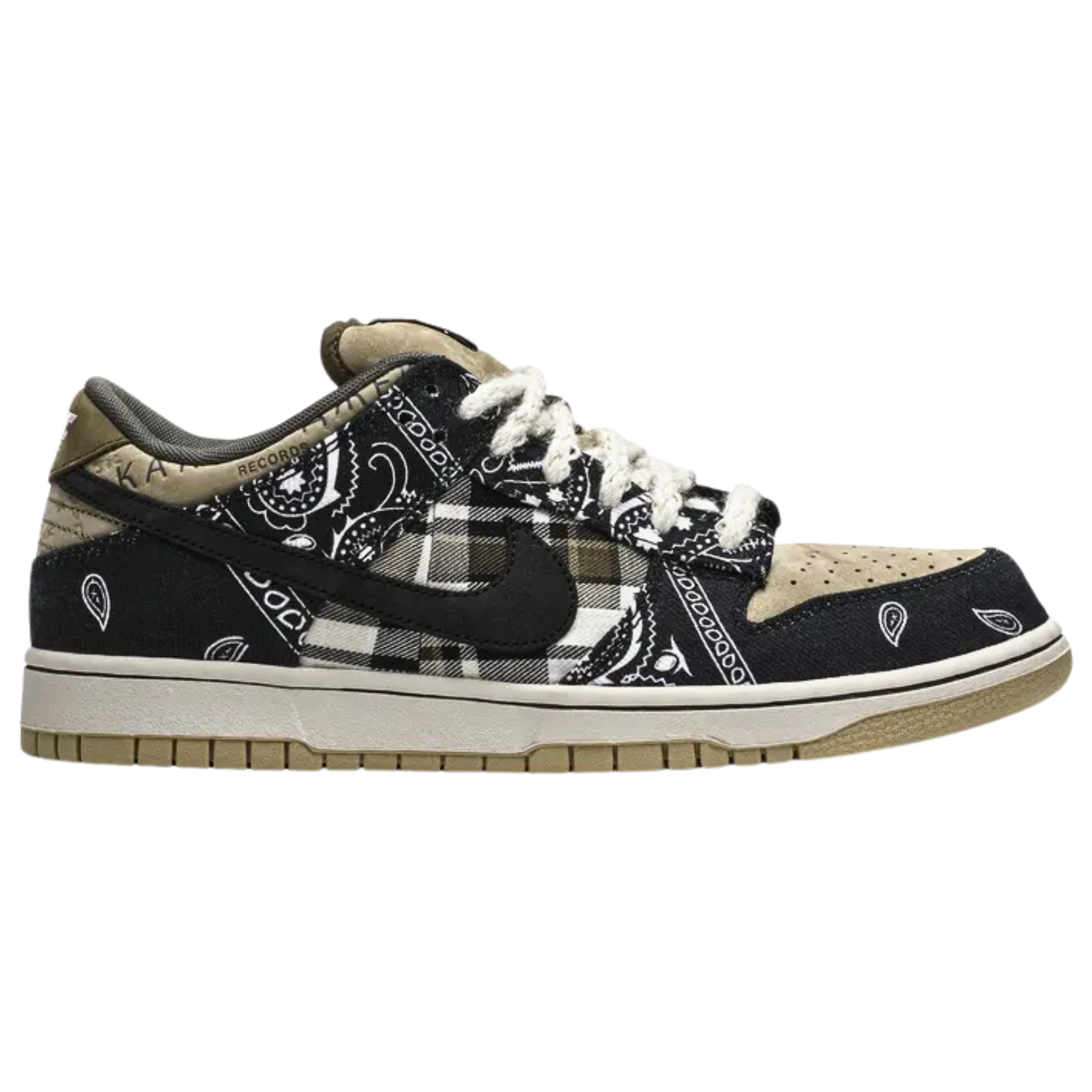 The Travis Scott x Nike Dunk Low SB features a unique patchwork design with a tan leather base, plaid quarter panels, and paisley print overlays that tear away to reveal hidden elephant print underneath. The contrasting patterns are paired with rope laces, Cactus Jack tongue tags, and mismatched black and pink Swooshes on each shoe. The sneaker is completed with a white midsole and a tan rubber outsole for a stylish and layered look.