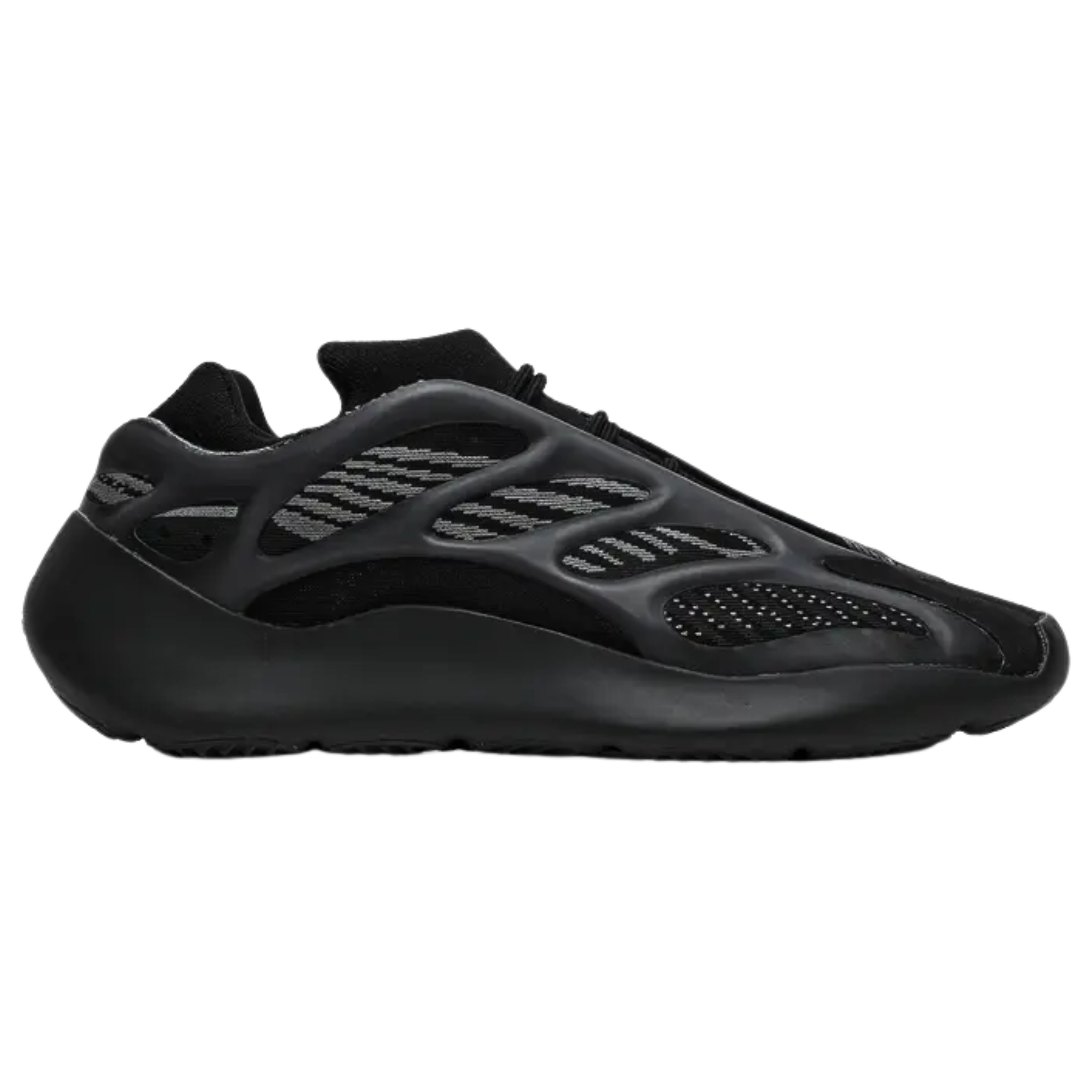 Shop the adidas Yeezy 700 V3 ‘Alvah,’ featuring a black and grey mesh upper with glow-in-the-dark RPU overlays for added support. The interior bootie construction ensures a snug fit, while reflective accents enhance visibility in low-light. The sneaker sits on a PU-encapsulated EVA midsole, offering a sleek, sculpted design without Boost cushioning.