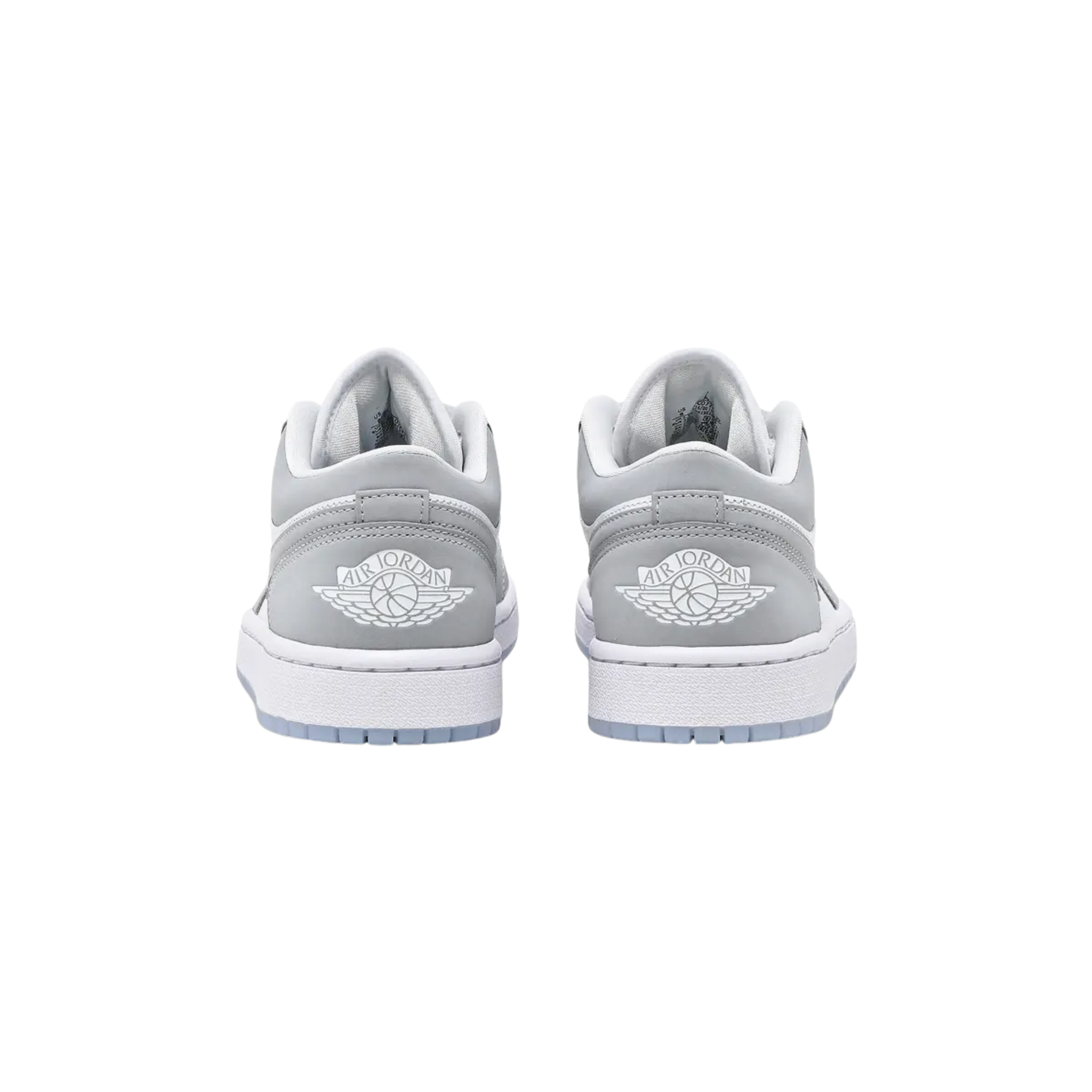 Wmns Air Jordan 1 Low 'White Wolf Grey' 2024 featuring a white leather upper with grey suede overlays and a grey Swoosh. The sneaker includes white laces, a woven Nike Air tongue tag, and a classic Wings logo on the heel tab. It sits on a white midsole with a grey rubber outsole.