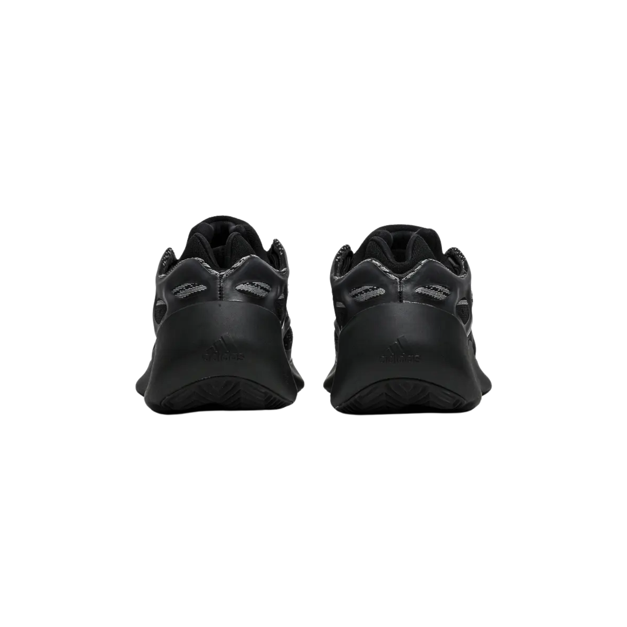 Shop the adidas Yeezy 700 V3 ‘Alvah,’ featuring a black and grey mesh upper with glow-in-the-dark RPU overlays for added support. The interior bootie construction ensures a snug fit, while reflective accents enhance visibility in low-light. The sneaker sits on a PU-encapsulated EVA midsole, offering a sleek, sculpted design without Boost cushioning.